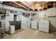 Basement laundry room featuring washer, dryer, and exposed ductwork at 1716 Beacon Hill Ne Blvd, Atlanta, GA 30329