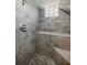 Modern shower features gray brick tiles and a built-in bench at 1716 Beacon Hill Ne Blvd, Atlanta, GA 30329