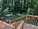 The deck provides a serene setting to enjoy nature with the surrounding trees and greenery at 4433 Ford Pl, Snellville, GA 30039