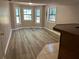 Finished basement with luxury vinyl plank flooring and bar at 4433 Ford Pl, Snellville, GA 30039
