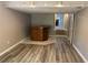 Finished basement with a built-in bar area, neutral paint, and tile flooring accents at 4433 Ford Pl, Snellville, GA 30039