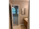 Bathroom featuring a vanity with a single sink, and a glimpse into a bedroom beyond the doorway at 4433 Ford Pl, Snellville, GA 30039