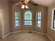 Cozy bedroom with neutral paint, carpet, and multiple windows providing natural light at 4433 Ford Pl, Snellville, GA 30039