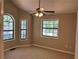 Bedroom with ceiling fan, neutral carpet, and ample natural light from multiple windows at 4433 Ford Pl, Snellville, GA 30039