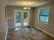 Bright dining room with french doors leading to deck with lots of natural light at 4433 Ford Pl, Snellville, GA 30039