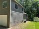 Side view of a well-maintained house showcasing its clean siding and neat landscaping at 4433 Ford Pl, Snellville, GA 30039
