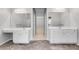 Bright bathroom featuring double vanity, granite countertop, cabinets and tile flooring at 543 Serene Waters Trl, Jonesboro, GA 30236