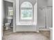 Bathroom with soaking tub, shower, large window and tile flooring at 543 Serene Waters Trl, Jonesboro, GA 30236