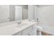 Well lit bathroom featuring a white sink, cabinets and bathtub at 543 Serene Waters Trl, Jonesboro, GA 30236
