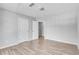 Bedroom featuring two doors, wood floor, light and neutral paint at 543 Serene Waters Trl, Jonesboro, GA 30236