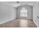 Bedroom with vaulted ceiling, wood floor, natural light and an arched window view at 543 Serene Waters Trl, Jonesboro, GA 30236