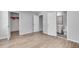 Bedroom featuring wood floor, door leading to bathroom and large closet at 543 Serene Waters Trl, Jonesboro, GA 30236