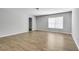 Bedroom with wood floor, one window and an open closet at 543 Serene Waters Trl, Jonesboro, GA 30236