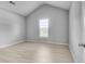 Bright bedroom featuring high ceilings and modern vinyl flooring at 543 Serene Waters Trl, Jonesboro, GA 30236