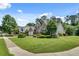 This home boasts a beautiful brick facade, lush lawn and attractive landscaping at 543 Serene Waters Trl, Jonesboro, GA 30236