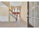 Bright foyer features hardwood floors, high ceilings, and a staircase at 543 Serene Waters Trl, Jonesboro, GA 30236