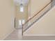 Bright foyer features high ceilings, hardwood floors, and a staircase with white railing at 543 Serene Waters Trl, Jonesboro, GA 30236