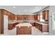 Bright kitchen features large island, plentiful cabinetry and stainless steel appliances at 543 Serene Waters Trl, Jonesboro, GA 30236