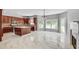 Spacious kitchen features stainless steel appliances, large island and bright adjacent dining area at 543 Serene Waters Trl, Jonesboro, GA 30236
