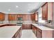 Bright kitchen features large island, plentiful cabinetry and stainless steel appliances at 543 Serene Waters Trl, Jonesboro, GA 30236