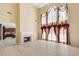 Bright open living room with fireplace, high ceilings and floor to ceiling windows at 543 Serene Waters Trl, Jonesboro, GA 30236