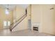 Spacious living room features fireplace, a staircase, and double front doors at 543 Serene Waters Trl, Jonesboro, GA 30236