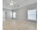 Spacious primary bedroom featuring lots of natural light and wood floors at 543 Serene Waters Trl, Jonesboro, GA 30236