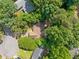 Aerial view showcases this homes beautiful lush surroundings and neighborhood at 10650 Colony Glen Dr, Johns Creek, GA 30022