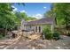 Charming backyard features a hot tub and deck, perfect for relaxation and entertaining at 10650 Colony Glen Dr, Johns Creek, GA 30022