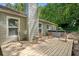 Inviting backyard deck featuring comfortable seating arrangements and a hot tub for outdoor enjoyment at 10650 Colony Glen Dr, Johns Creek, GA 30022