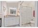 This bathroom features a glass shower, granite countertop, and tiled floors at 10650 Colony Glen Dr, Johns Creek, GA 30022