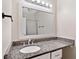 The bathroom boasts an expansive granite vanity and well-lit mirror at 10650 Colony Glen Dr, Johns Creek, GA 30022
