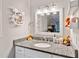 This bathroom features a vanity with granite countertop and a bright mirror at 10650 Colony Glen Dr, Johns Creek, GA 30022