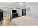 The primary bedroom with vaulted ceilings, wood floors, and full ensuite bathroom at 10650 Colony Glen Dr, Johns Creek, GA 30022