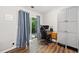 Bedroom featuring wood floors, backyard access, and built-in storage at 10650 Colony Glen Dr, Johns Creek, GA 30022