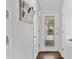 Bright foyer featuring white walls, hardwood floors, decorative door, and closet for coats and storage at 10650 Colony Glen Dr, Johns Creek, GA 30022