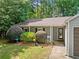 Charming single-story home with a two-car garage and lush landscaping in a serene, wooded setting at 10650 Colony Glen Dr, Johns Creek, GA 30022