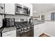 Modern kitchen featuring stainless steel appliances and granite countertops at 10650 Colony Glen Dr, Johns Creek, GA 30022