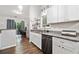 Kitchen features white cabinets and stainless steel appliances and granite countertops at 10650 Colony Glen Dr, Johns Creek, GA 30022
