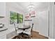 Eat-in kitchen with modern lighting, a large window, and a dining nook area at 10650 Colony Glen Dr, Johns Creek, GA 30022