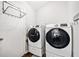 Modern laundry room features side-by-side washer and dryer units at 10650 Colony Glen Dr, Johns Creek, GA 30022