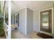 Covered porch with decorative front door, privacy, and outdoor light fixture at 10650 Colony Glen Dr, Johns Creek, GA 30022