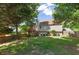 Exterior view of home with a spacious fenced-in backyard and wooden deck at 2577 Abbotts Glen Nw Dr, Acworth, GA 30101