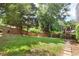 Large backyard featuring well-maintained lawn and a privacy fence at 2577 Abbotts Glen Nw Dr, Acworth, GA 30101