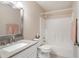 Bright bathroom with granite vanity, framed mirror, and a shower-tub combination at 2577 Abbotts Glen Nw Dr, Acworth, GA 30101