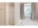Relaxing bathroom showcasing a garden tub next to a window with natural lighting at 2577 Abbotts Glen Nw Dr, Acworth, GA 30101