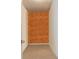 Walk-in closet featuring neutral carpet and a textured accent wall at 2577 Abbotts Glen Nw Dr, Acworth, GA 30101
