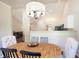 Open dining area with wood table, cushioned chairs, and pendant lighting at 2577 Abbotts Glen Nw Dr, Acworth, GA 30101