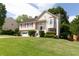 Charming two-story home with a well-manicured lawn, attached garage, and a welcoming front porch at 2577 Abbotts Glen Nw Dr, Acworth, GA 30101