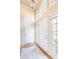 Bright foyer featuring soaring ceilings, hardwood floors, and ample natural light from the windows at 2577 Abbotts Glen Nw Dr, Acworth, GA 30101